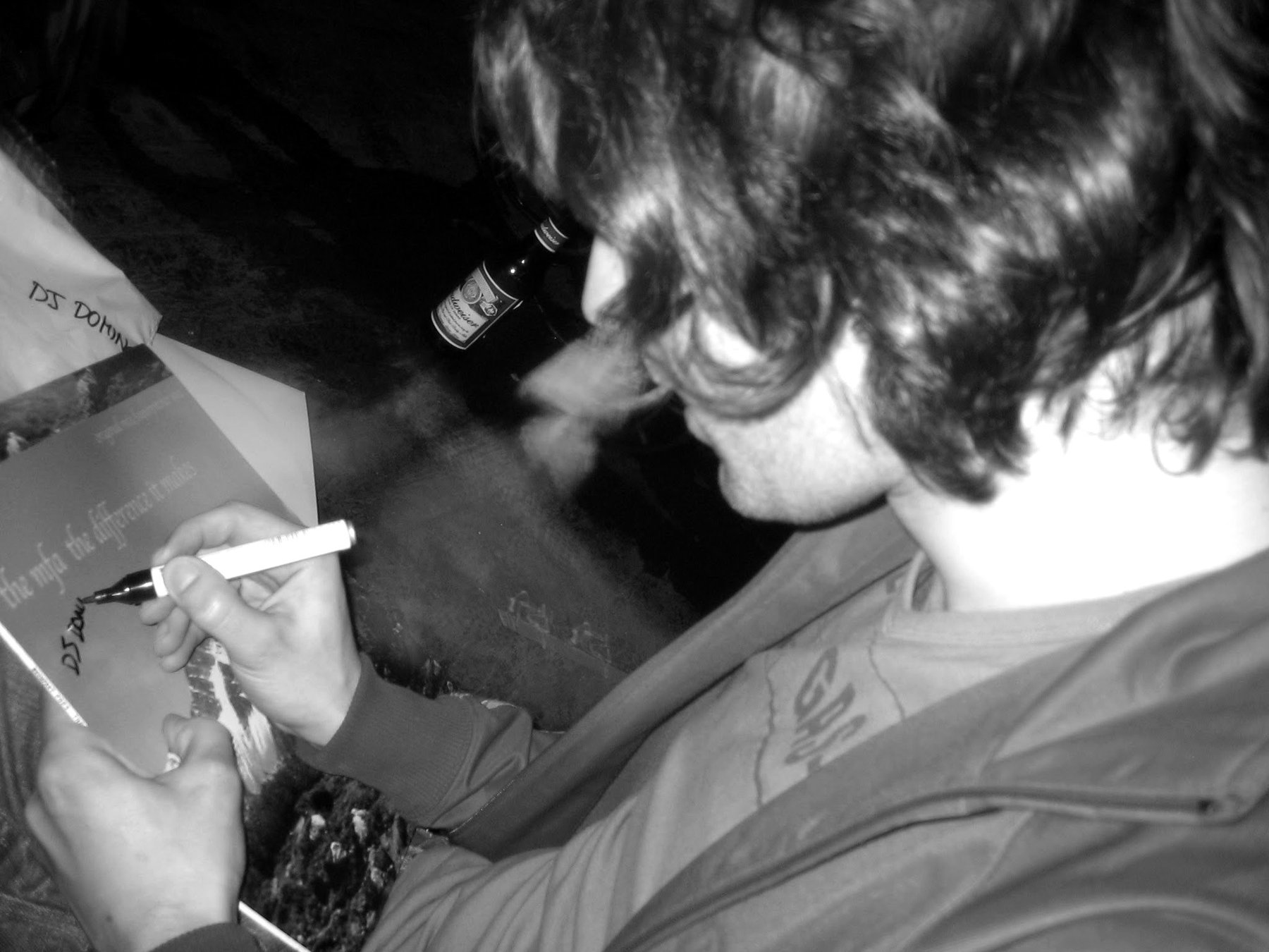 Rhys signing a copy of 'The Difference It Makes', 2006.